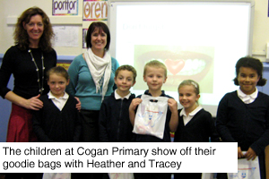 The children at Cogan Primary show off their goodie bags with Heather and Tracey